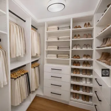 Organized custom closet system with shelving and drawers