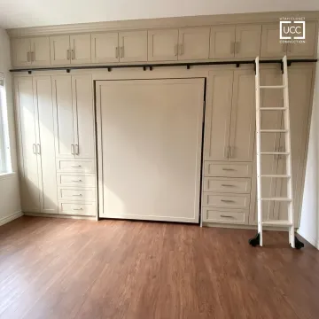 Custom Murphy bed folded into built-in wall cabinetry