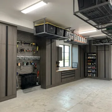 Organized garage with custom cabinets and workbench