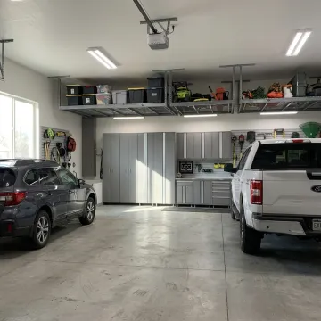 Organized garage with overhead storage racks