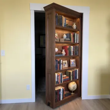 Custom hidden bookcase door in a modern home