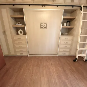 Custom Murphy bed in modern built-in cabinetry