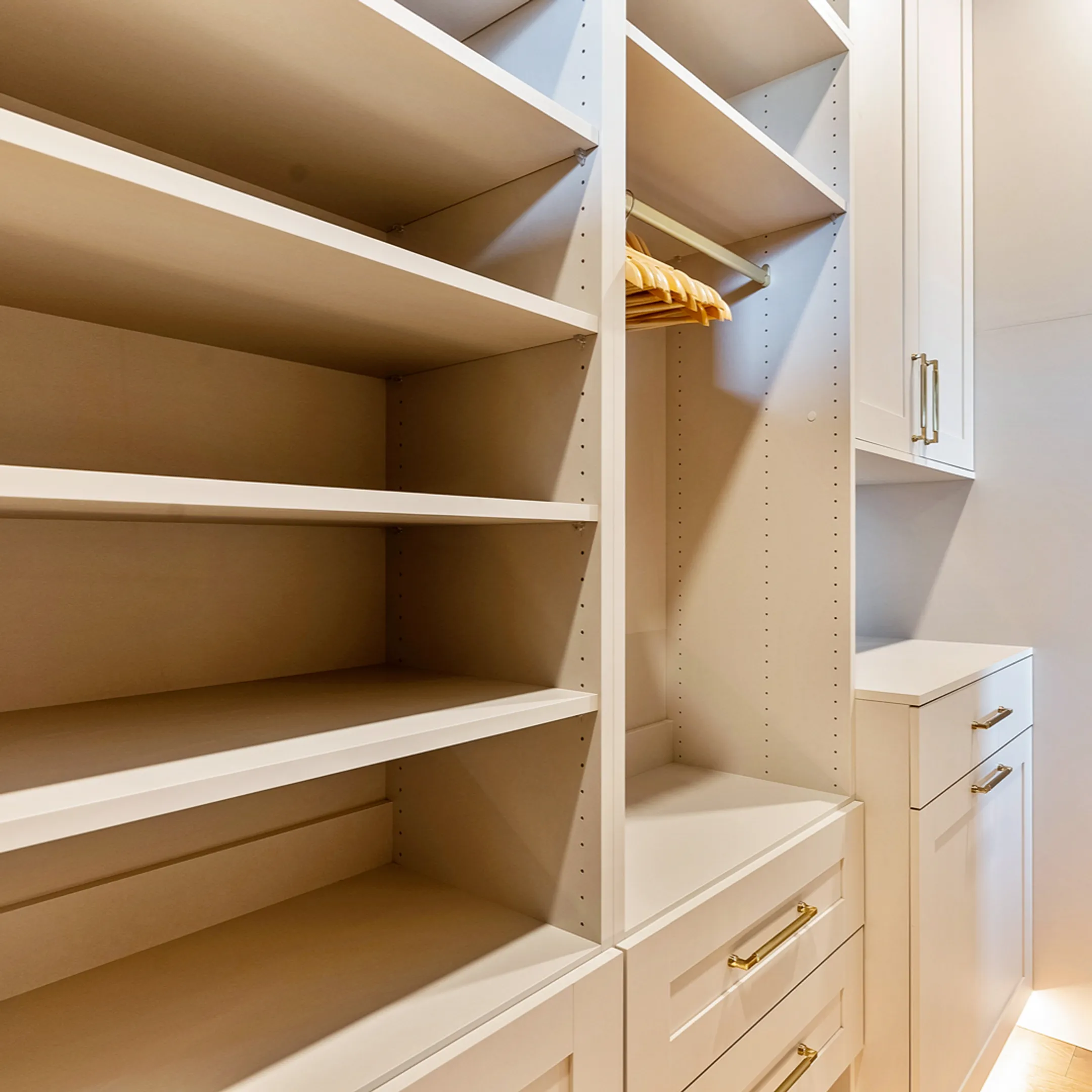 Custom closet organizer with shelves and drawers