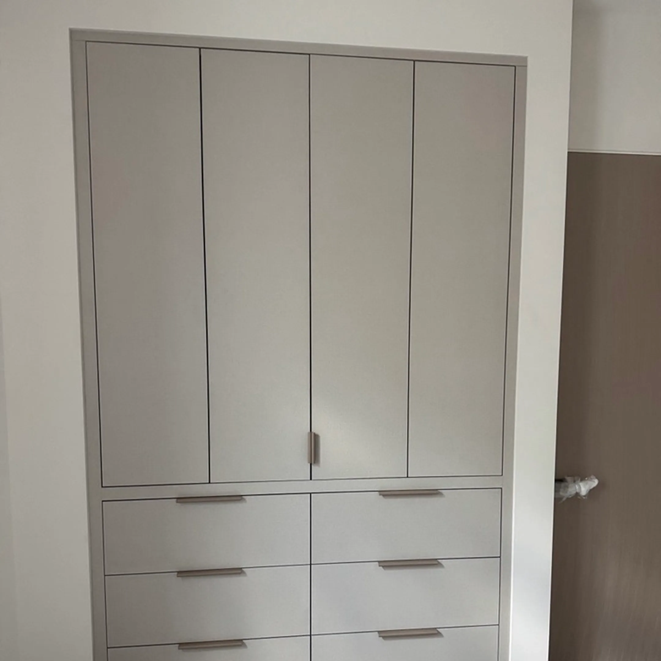 Designer reviewing plans for a custom closet installation