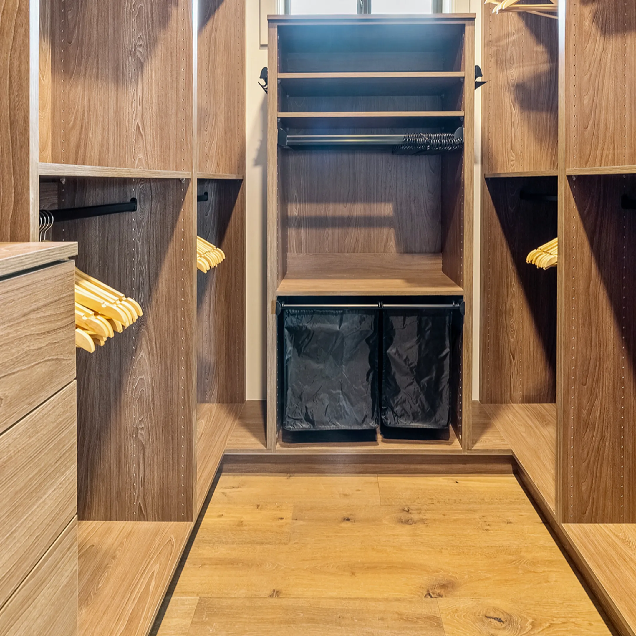 Custom walk-in closet with built-in shelves and drawers