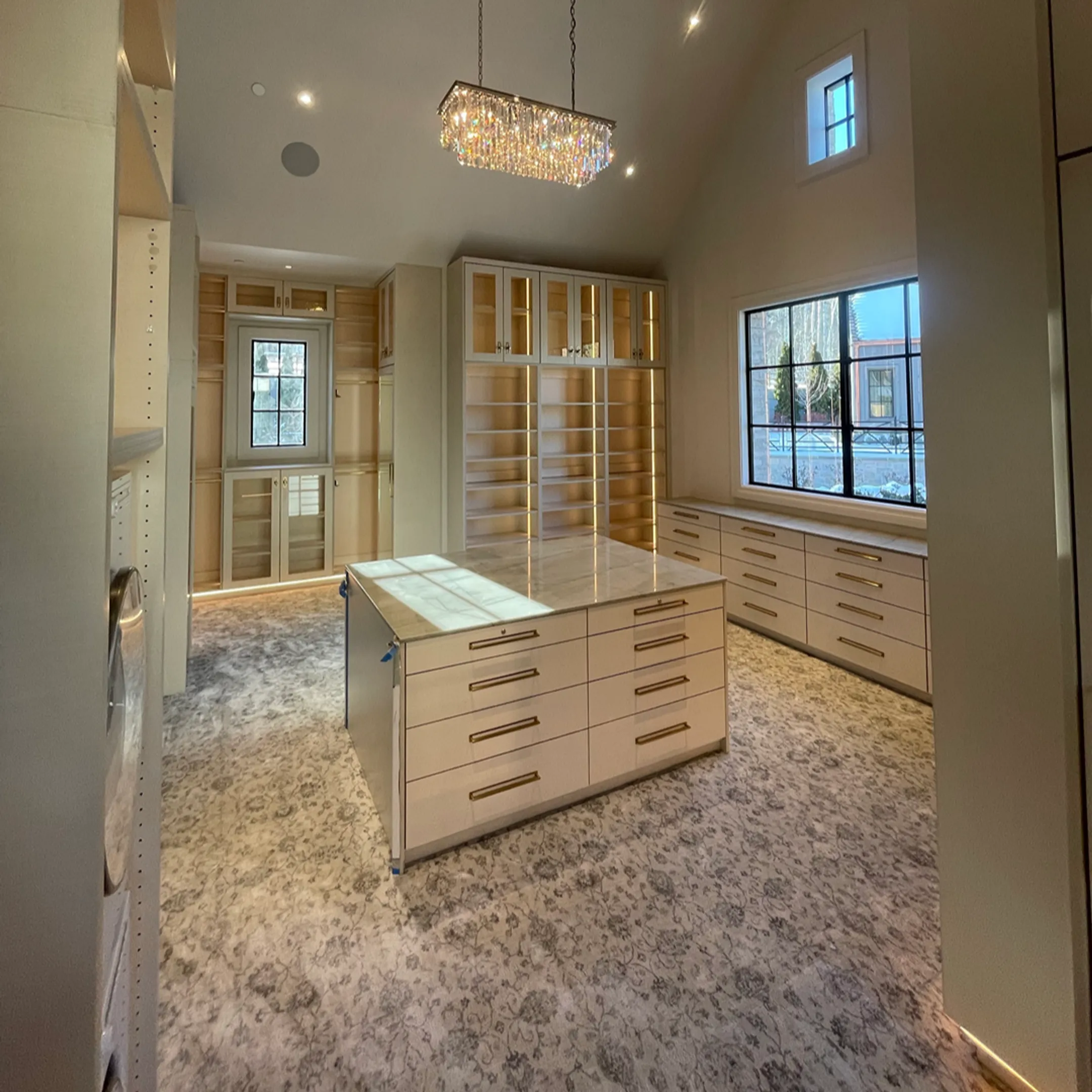 Modern custom walk-in closet with shelving and drawers