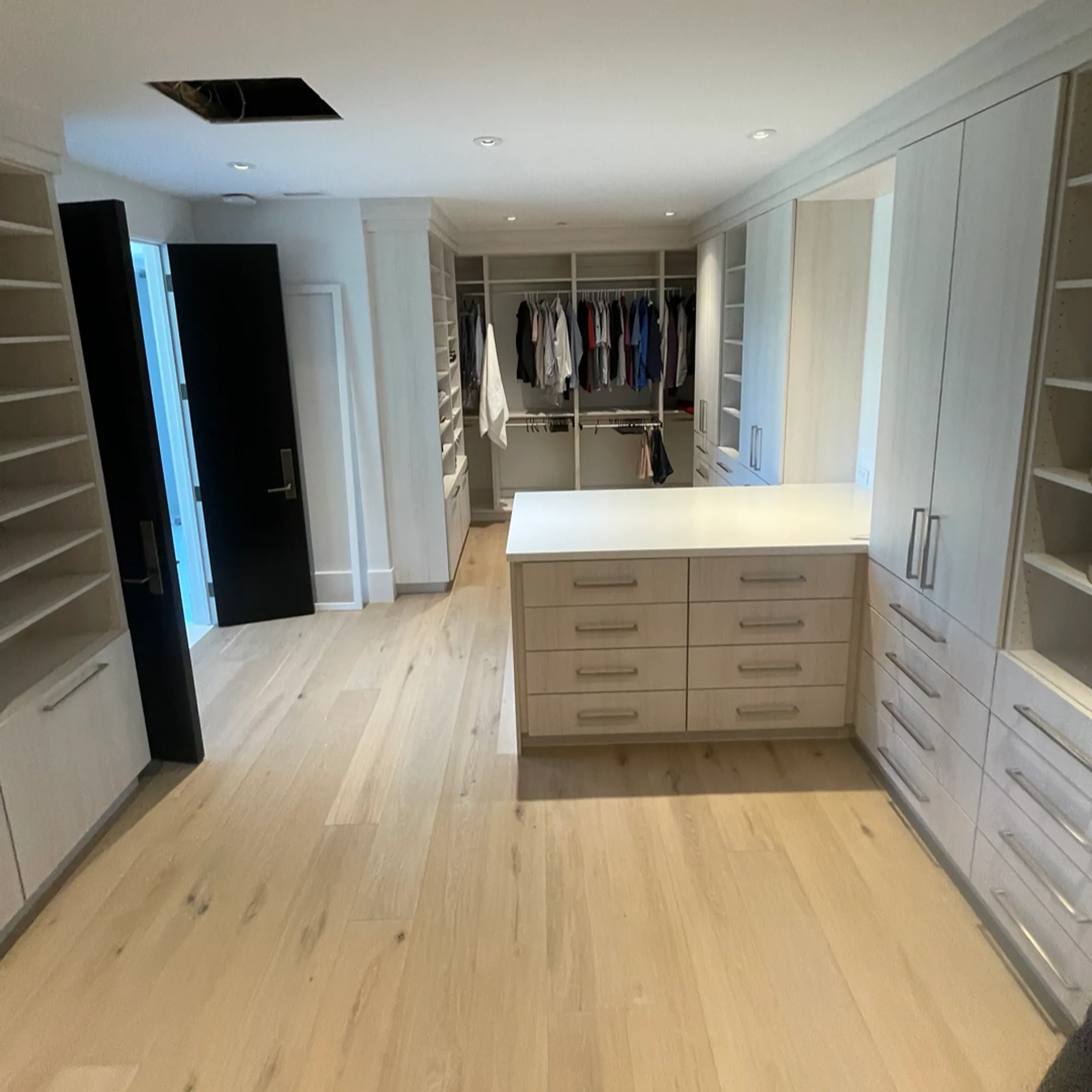 Custom closet with organized shelves and drawers