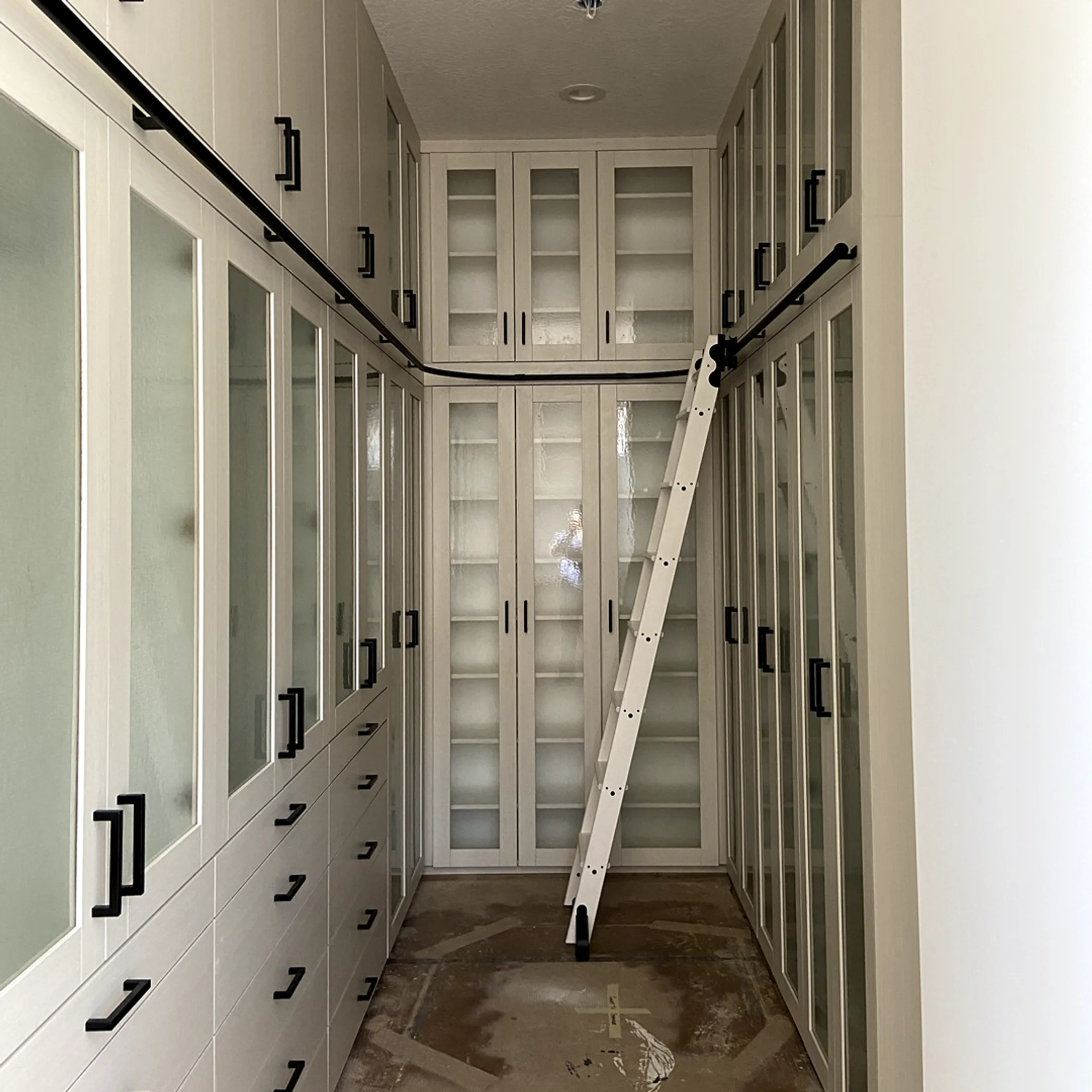 Installer aligning a custom hidden bookcase door