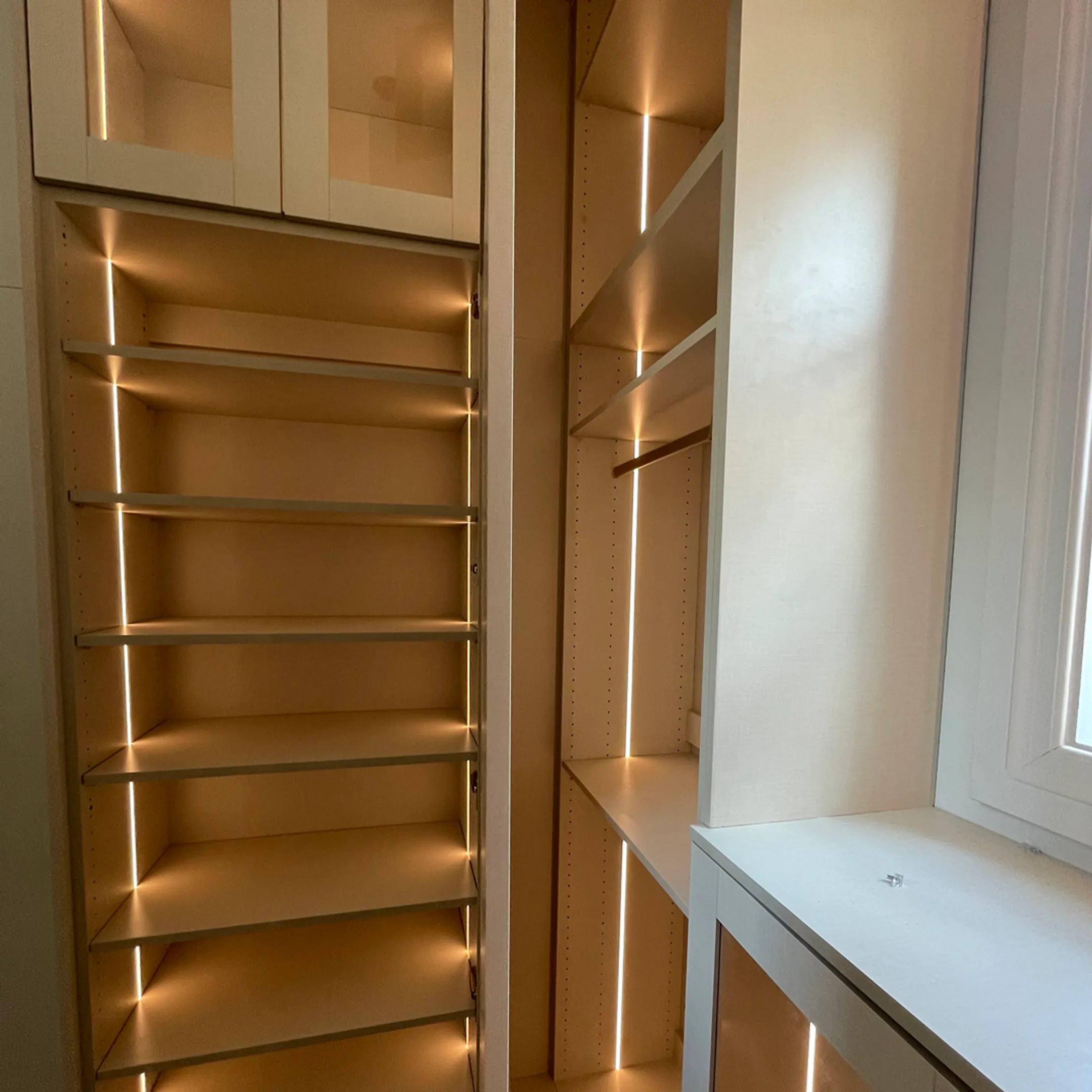 Designer reviewing plans for a custom men’s closet