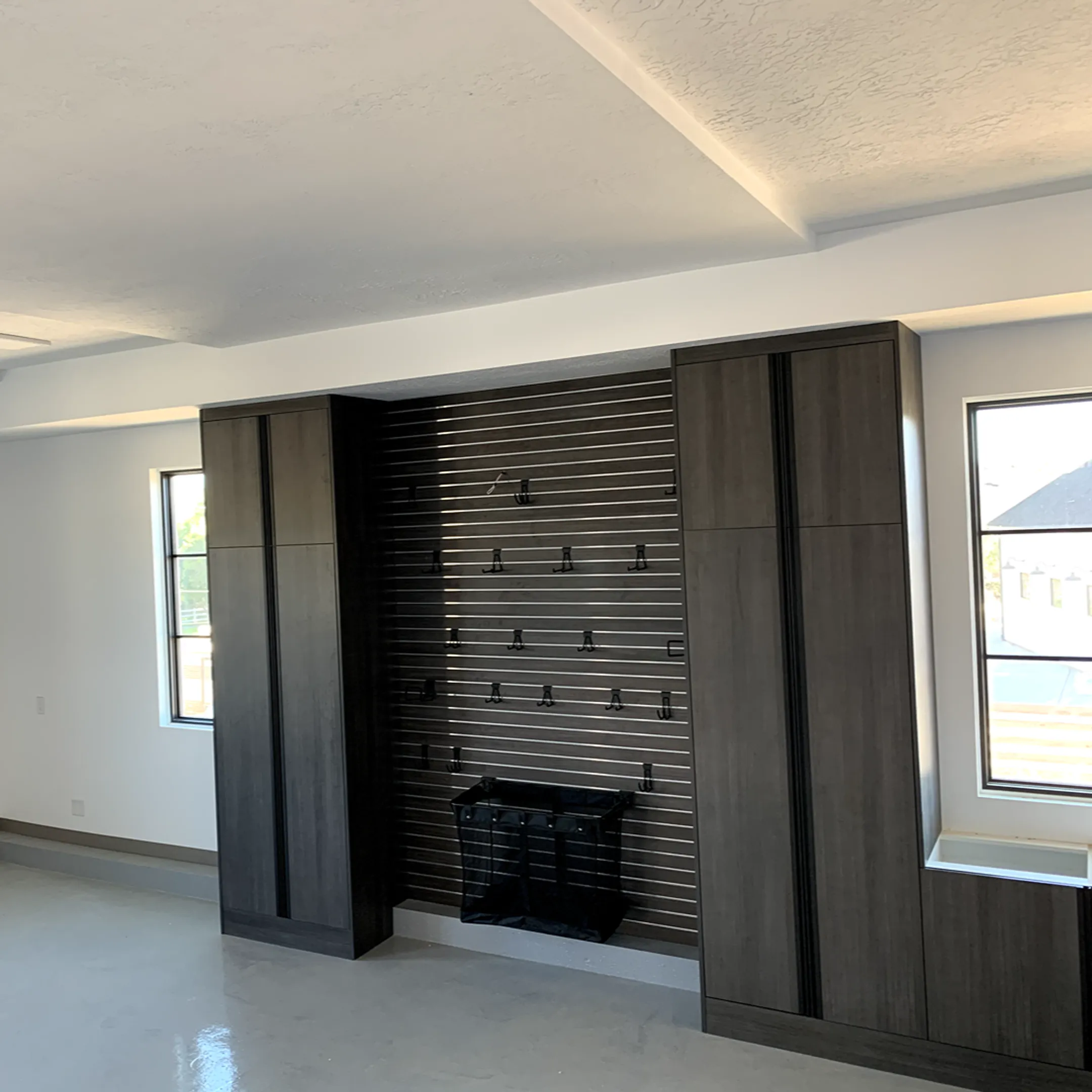 Installer fitting custom living room cabinets