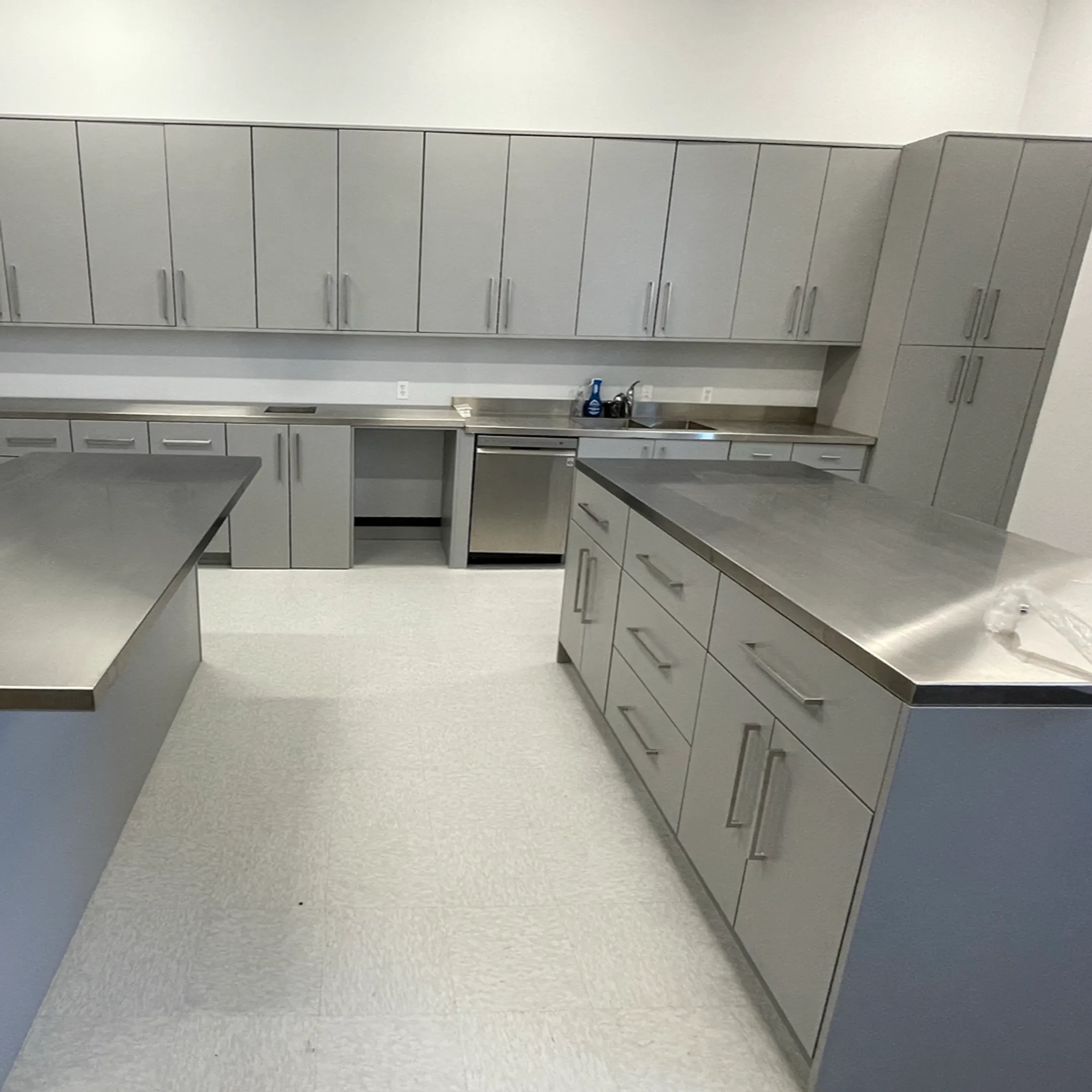 Designer reviewing custom cabinet plans in organized storage space