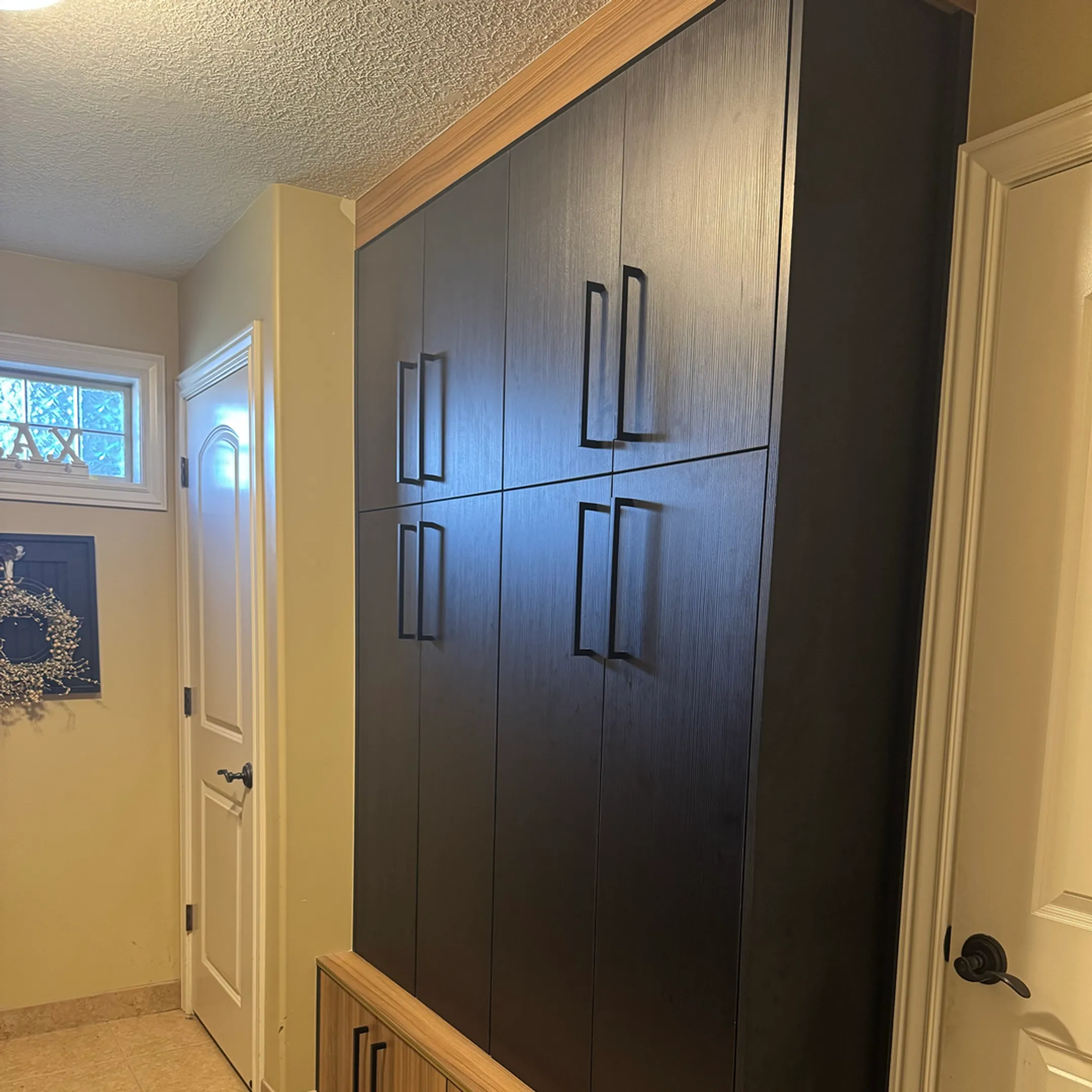Installer fitting custom built-in cabinets