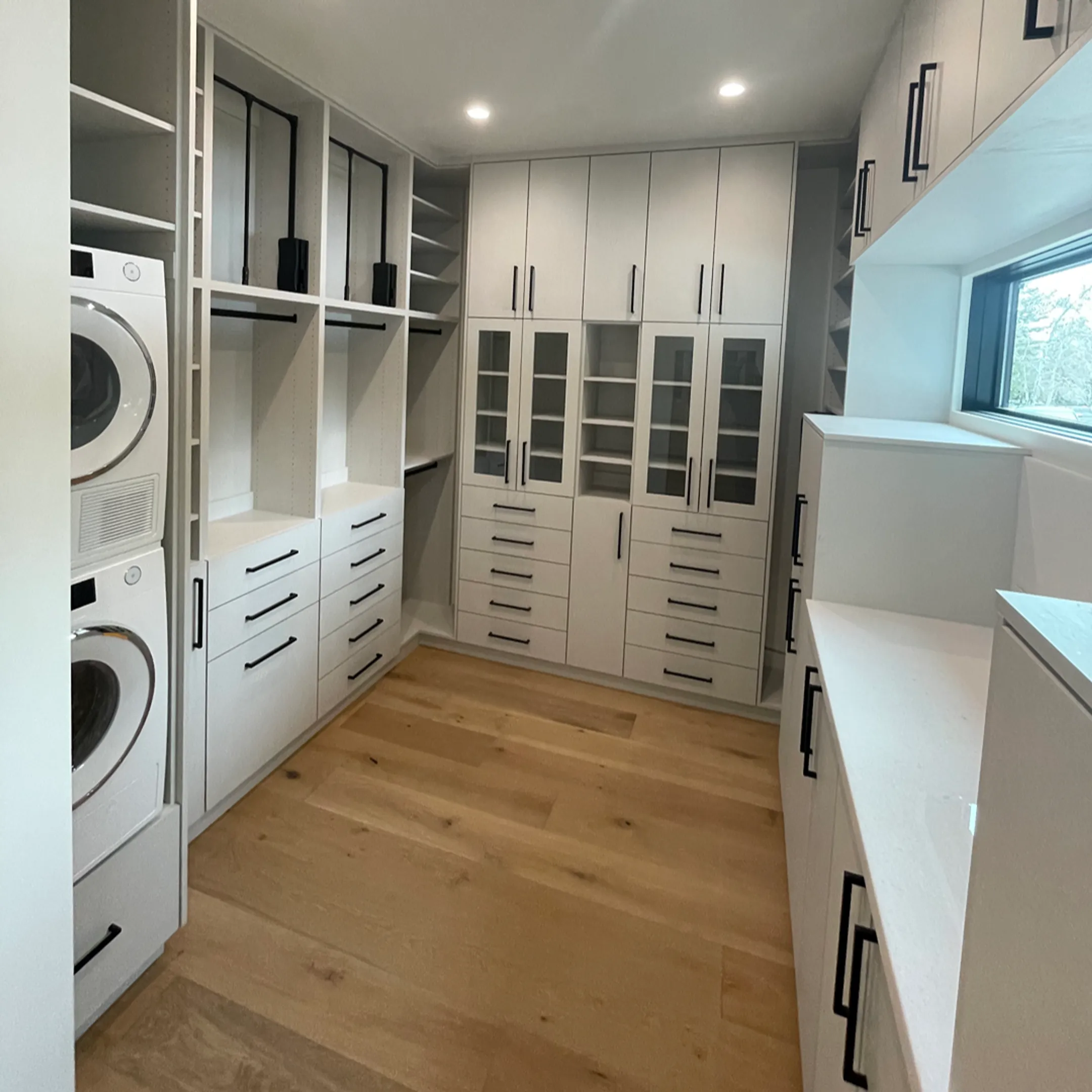 Designer reviewing custom cabinet plans during installation