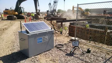 uWave remote noise monitoring station deployed at construction site boundary with solar panel