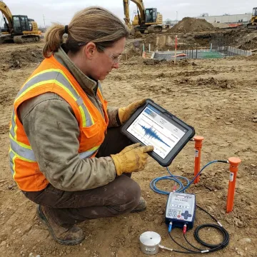 Technician reviewing remote vibration monitoring dashboard