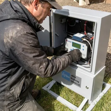 Technician configuring a remote monitoring system