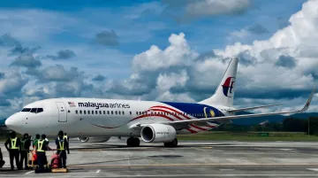 Malaysia Airlines aircraft at airport representing high-trust airline brand rebranding