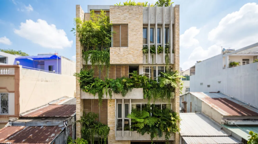 Award-winning Vietnamese modernist building featuring biophilic green facade and natural materials