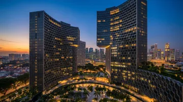 DUO Singapore twin towers honeycomb facade and civic public spaces at night