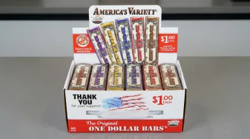 Boxed chocolate bars for fundraiser sale display with pricing signage