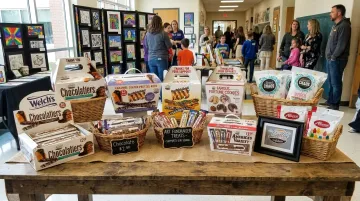 Van Wyk Confections treat table display with chocolate bars and pretzel rods