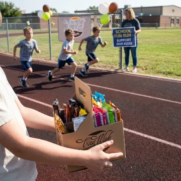 School fun run fundraiser with students and volunteers
