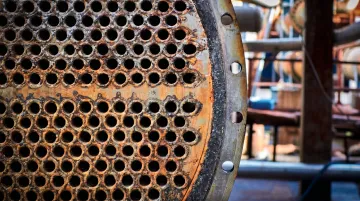 Heat exchanger tubes showing corrosion damage from high-temperature chemical exposure