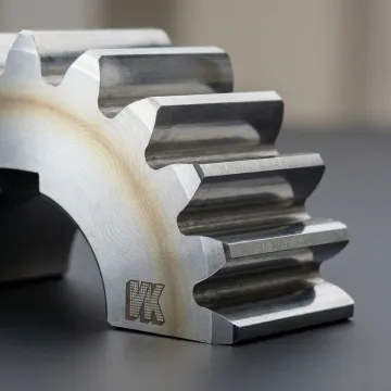 Cross-section of a nitrided metal gear showing hardened surface layer