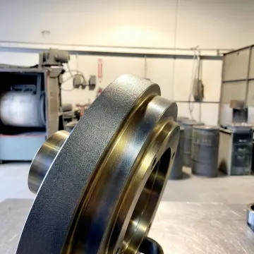 Close-up of a boronized industrial pump component with hardened metal surface coating