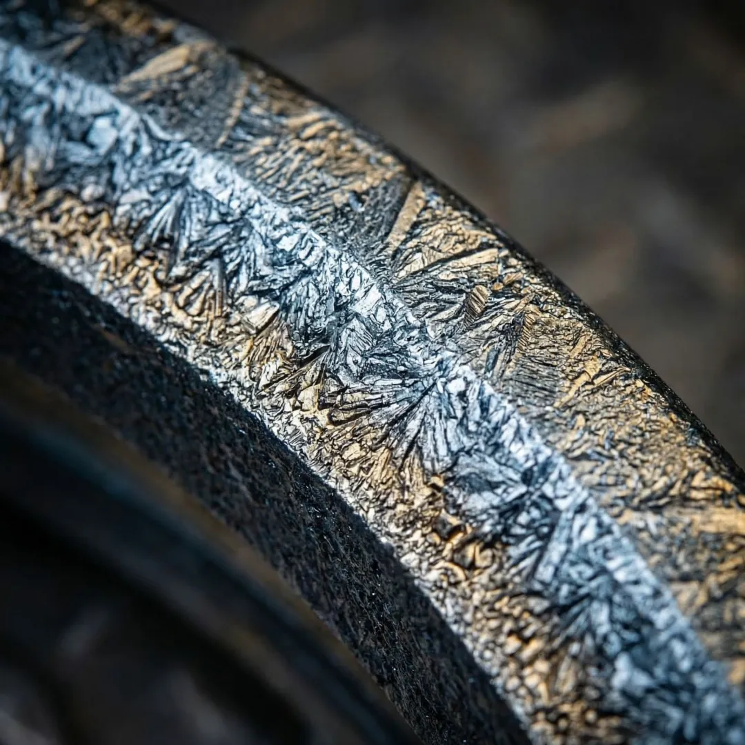 Close-up of a boronized metal pump impeller showing a hardened protective coating surface