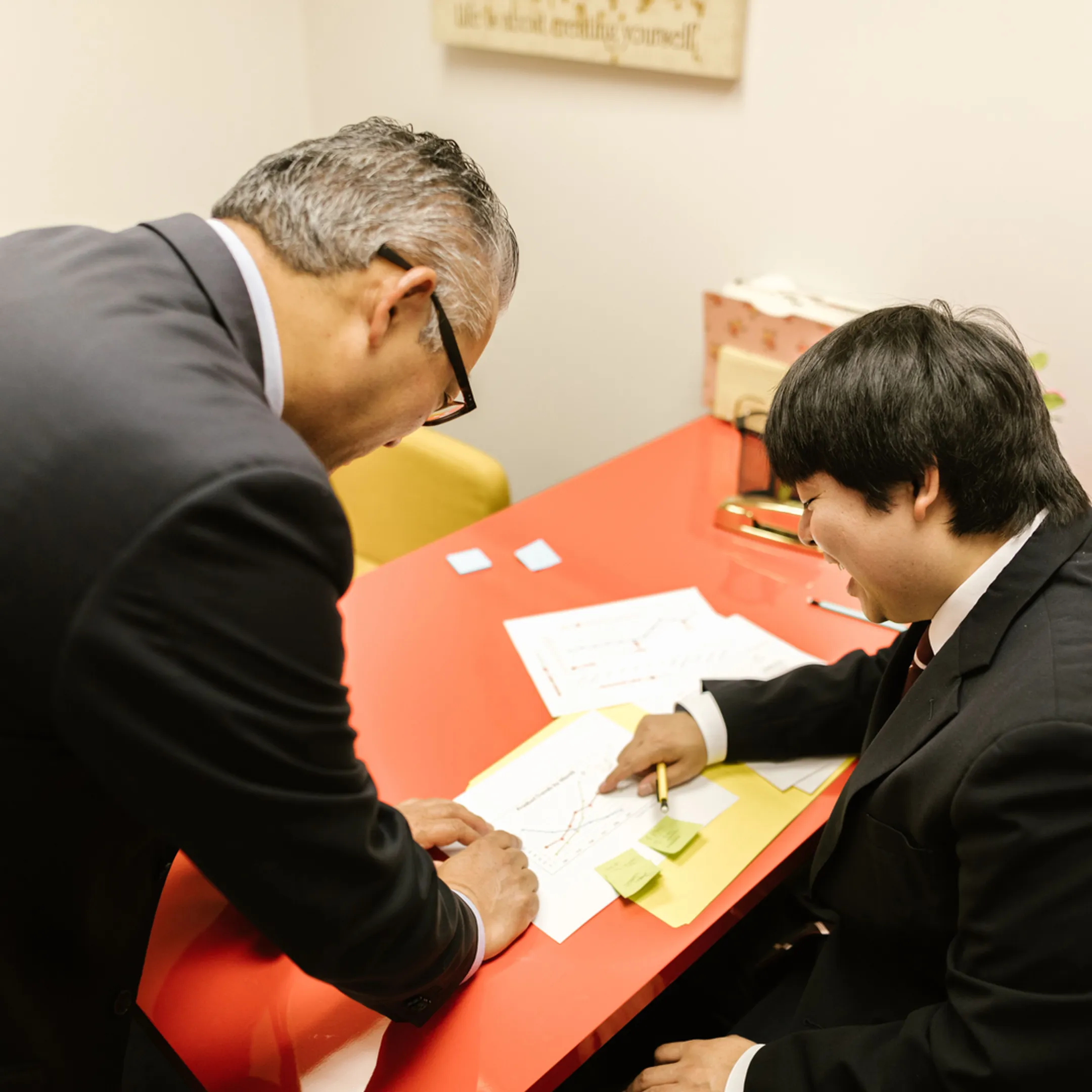 Finance operator collaborating with company founders