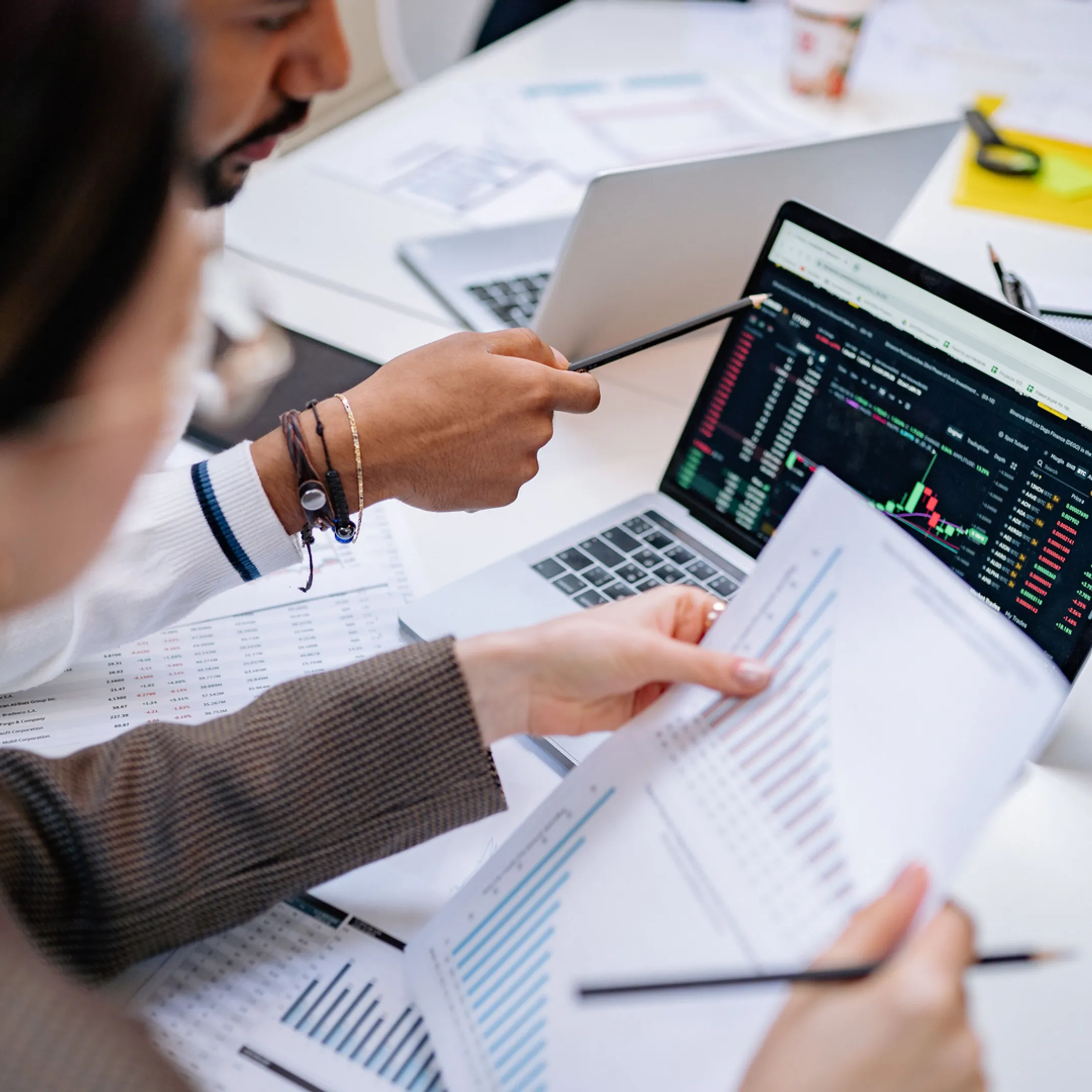 Fractional CFO reviewing financial reports with a business leadership team