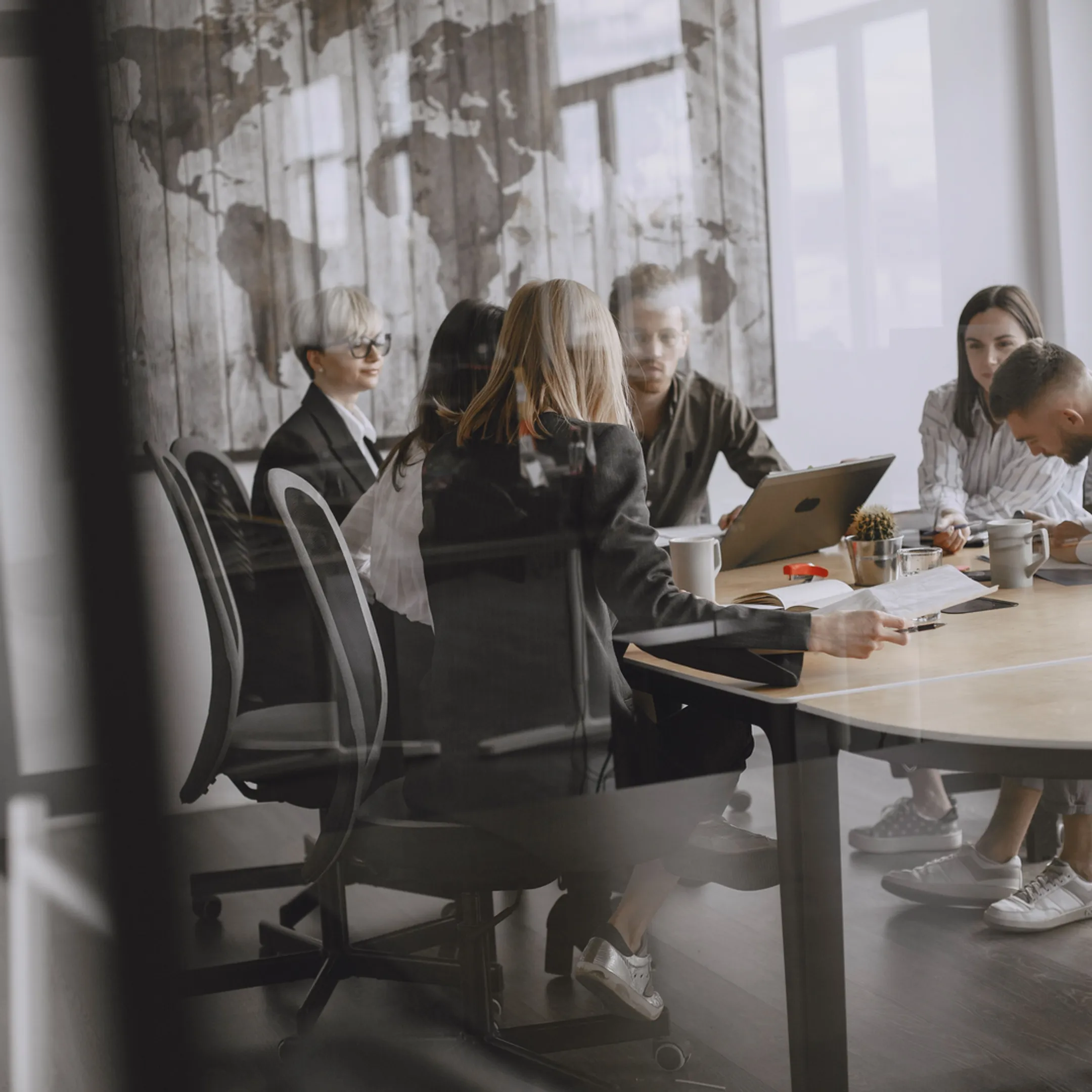 Senior operators coordinating a post-merger integration meeting