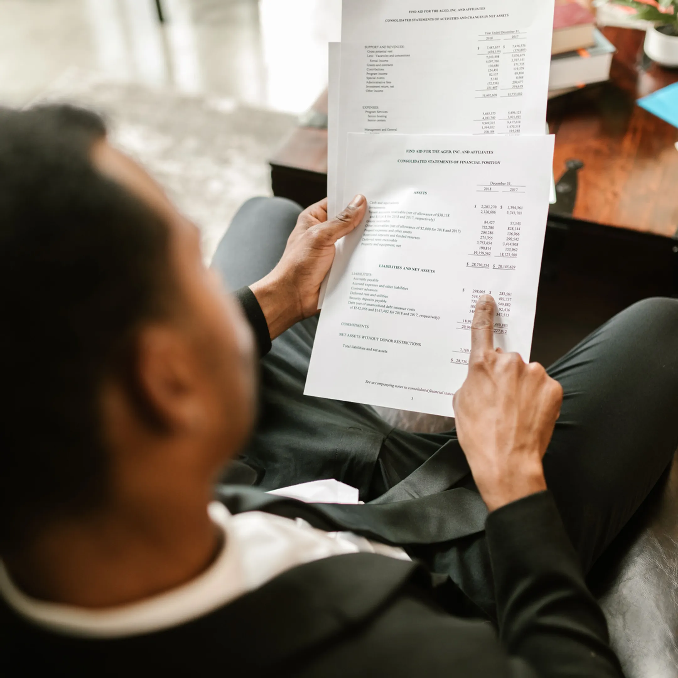 Advisor analyzing financial data for a transaction