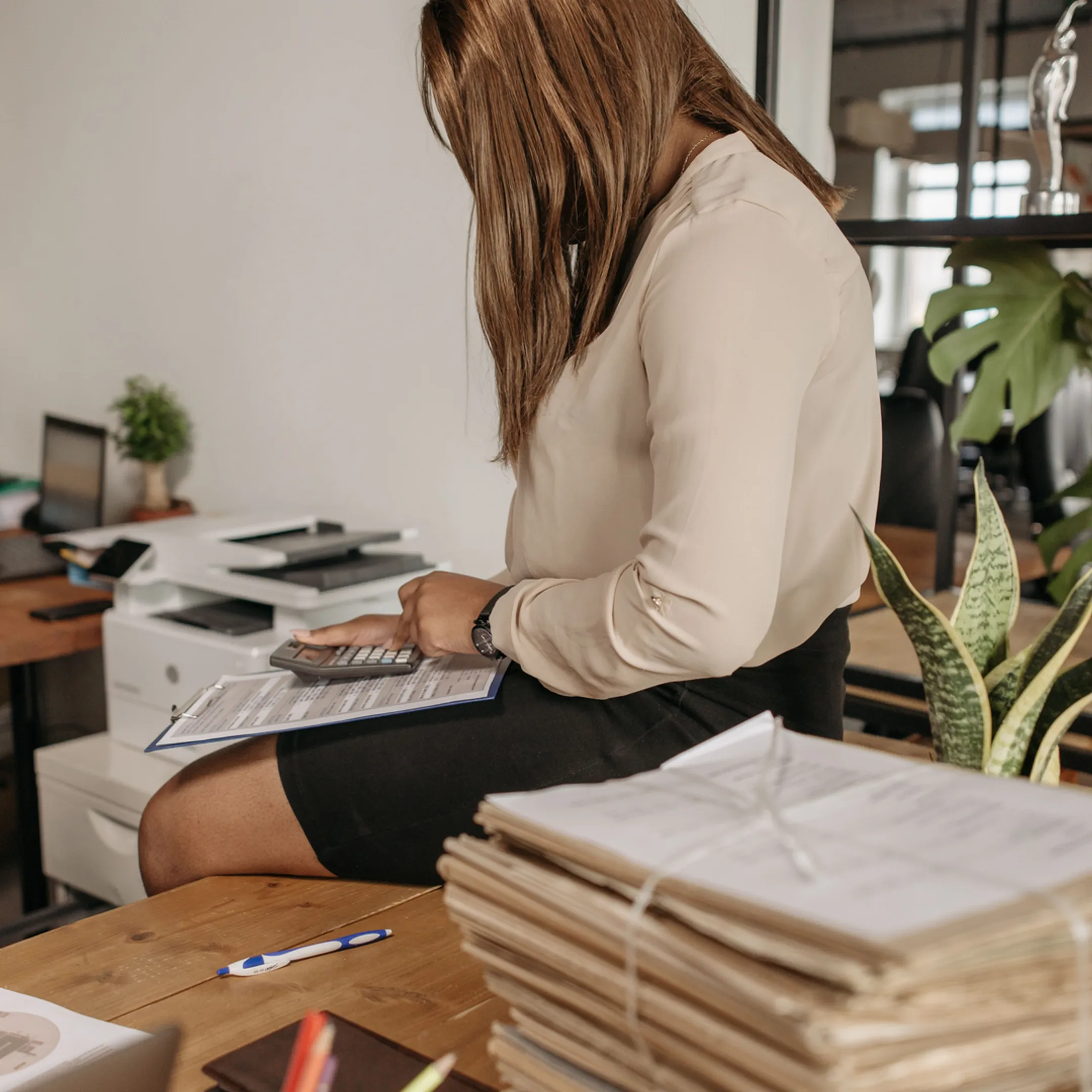 Senior compliance professional reviewing policies with an executive team