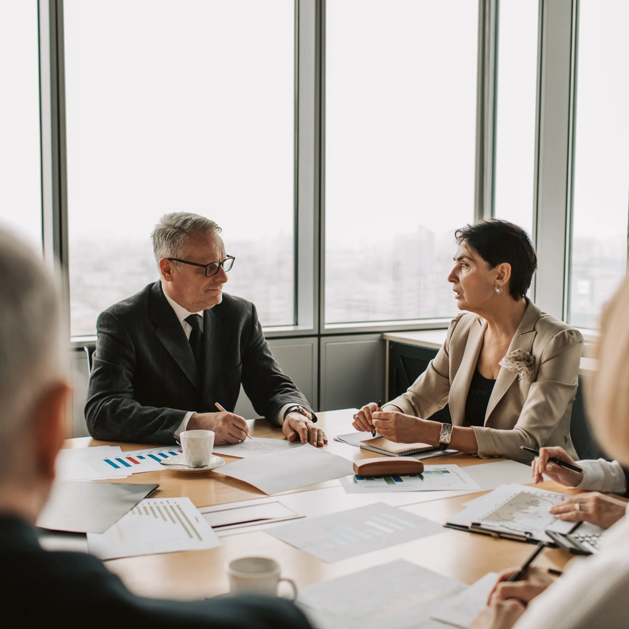 Fractional CFO reviewing financial reports with a Los Angeles startup founder