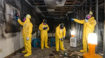 IICRC-certified restoration crew conducting commercial fire damage assessment on-site