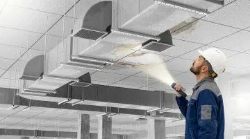 Commercial building HVAC unit and ceiling cavity showing hidden mold growth inspection