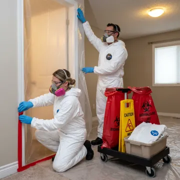Biohazard cleanup crew setting containment
