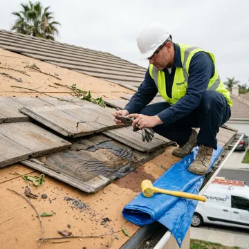 Technician documenting roof storm damage