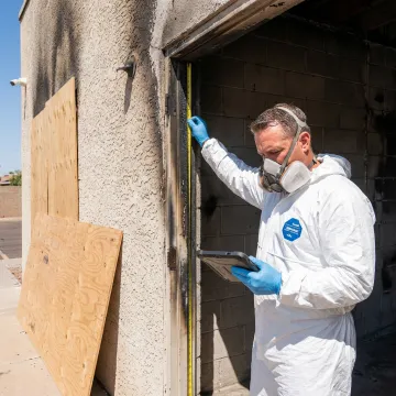 Technician documenting commercial fire damage