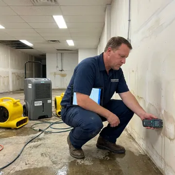 Restoration team documenting flood damage