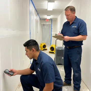 Commercial mold remediation team inspecting a building