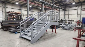 Fabricated structural steel components including stairs handrails and piping assemblies