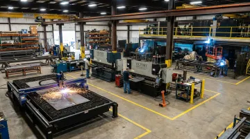 Victory Industrial Construction fabrication shop floor with CNC and welding equipment