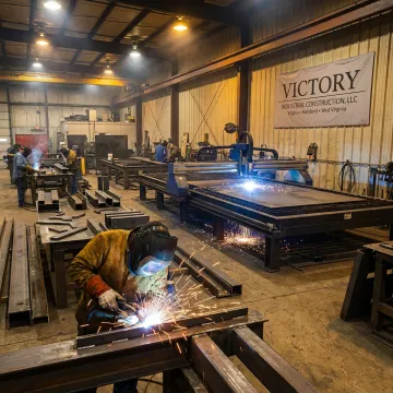 Steel fabrication and welding in an industrial shop