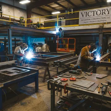 Custom metal fabrication shop with welding and steel parts