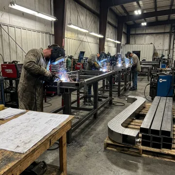 Custom metal frame fabrication in industrial shop