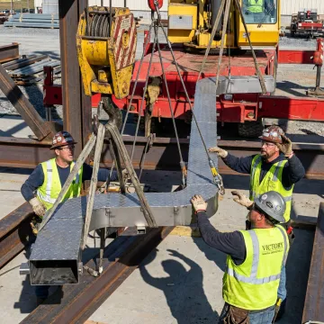 Industrial lifting and rigging equipment handling heavy machinery