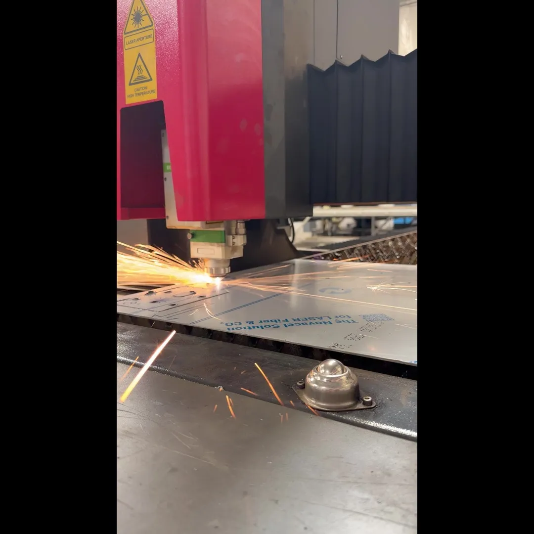 Fabricator reviewing metal part drawings